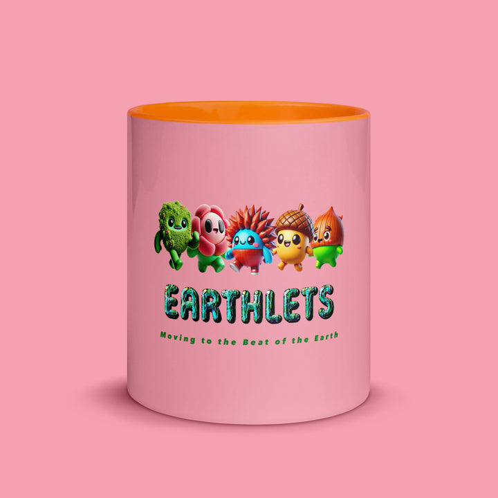 Earthlets mug with colorful inside featuring cute characters design and text 'Moving to the Beat of the Earth'.