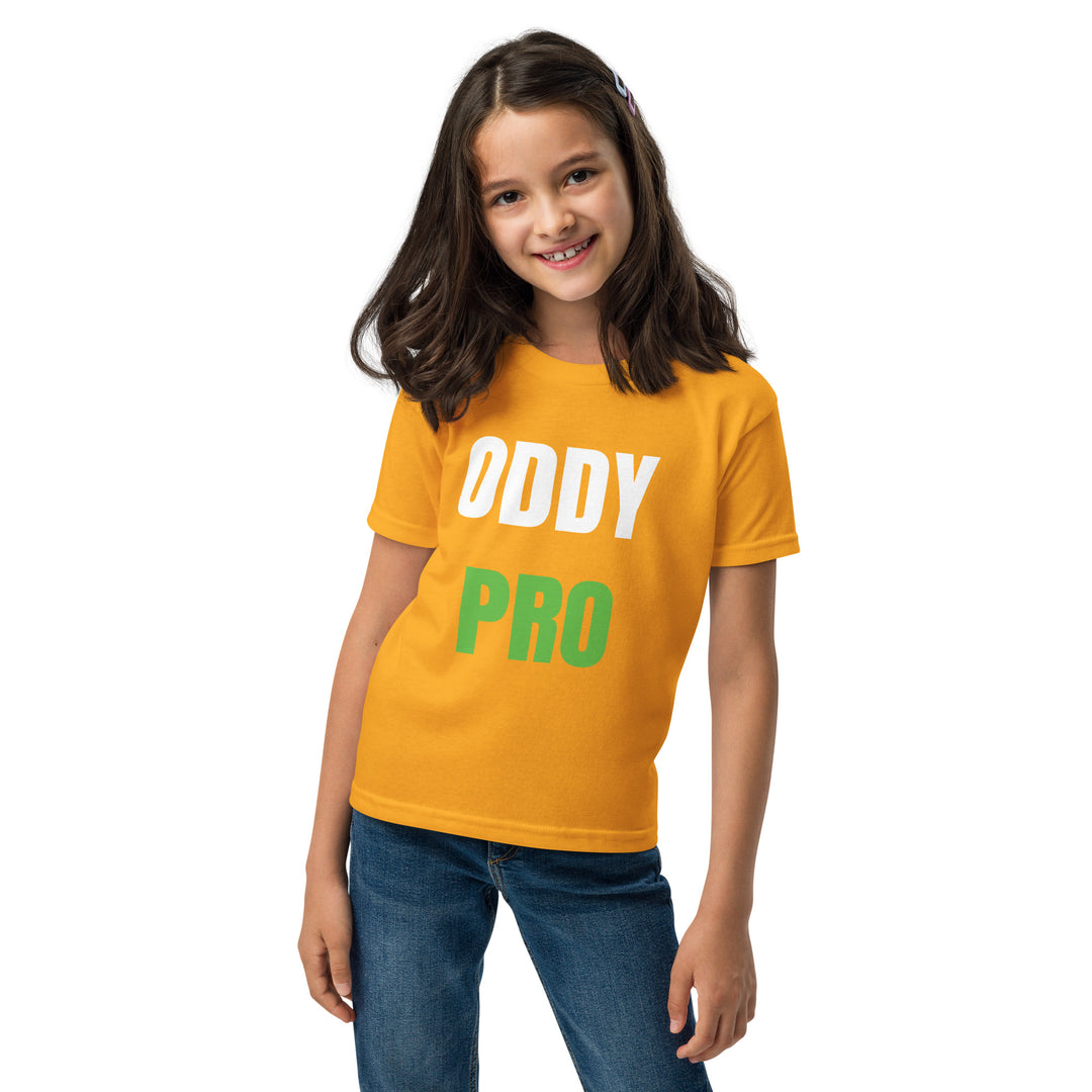 Girl wearing an Oddy Pro Youth t-shirt in bright orange, showcasing the brand's logo in bold lettering.