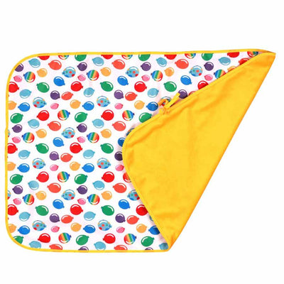 Colorful Happy Mat with absorbent fluffy top and waterproof underside, featuring vibrant balloon pattern and rolled corner display.