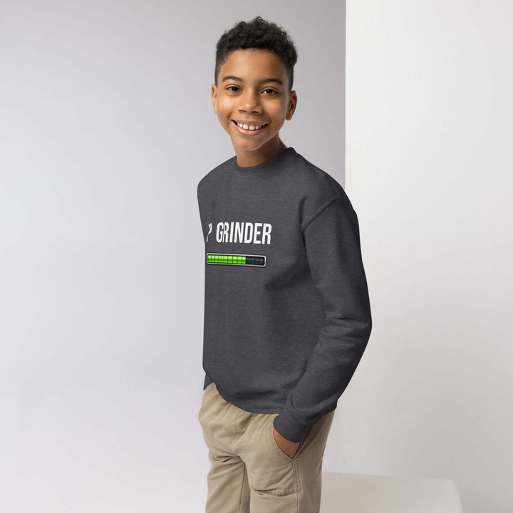 XP Grinder Youth crewneck sweatshirt worn by a smiling boy in a casual setting.
