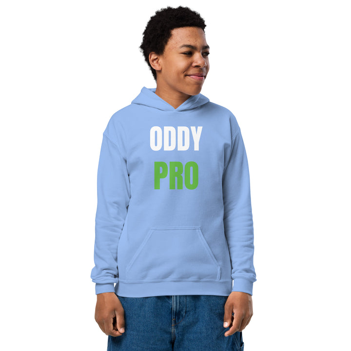 Oddy Pro Youth heavy blend hoodie worn by a cheerful child in a light blue color, featuring bold text design.