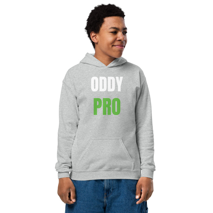 Boy wearing Oddy Pro Youth heavy blend hoodie in grey, featuring large letters, perfect for active children.