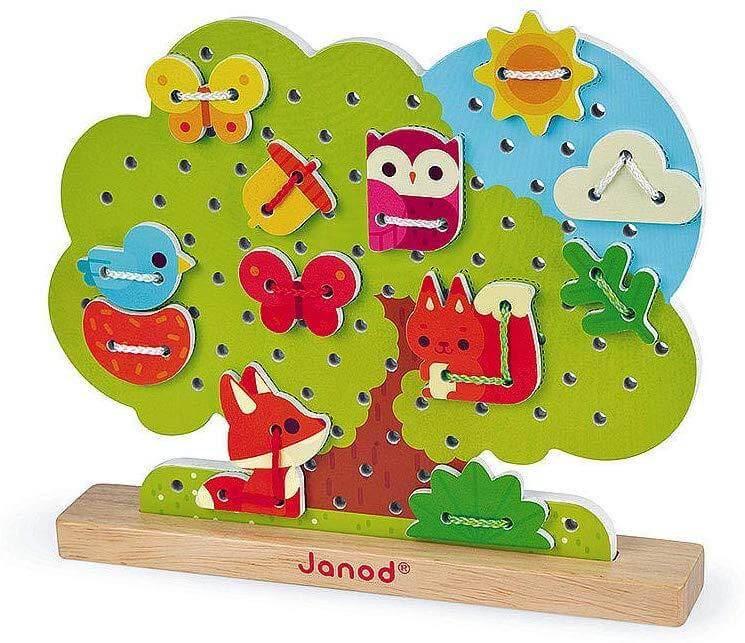 Wooden lace-up tree toy with animals and decorations for kids, featuring vibrant colors, by Janod. Promotes motor skills and coordination.